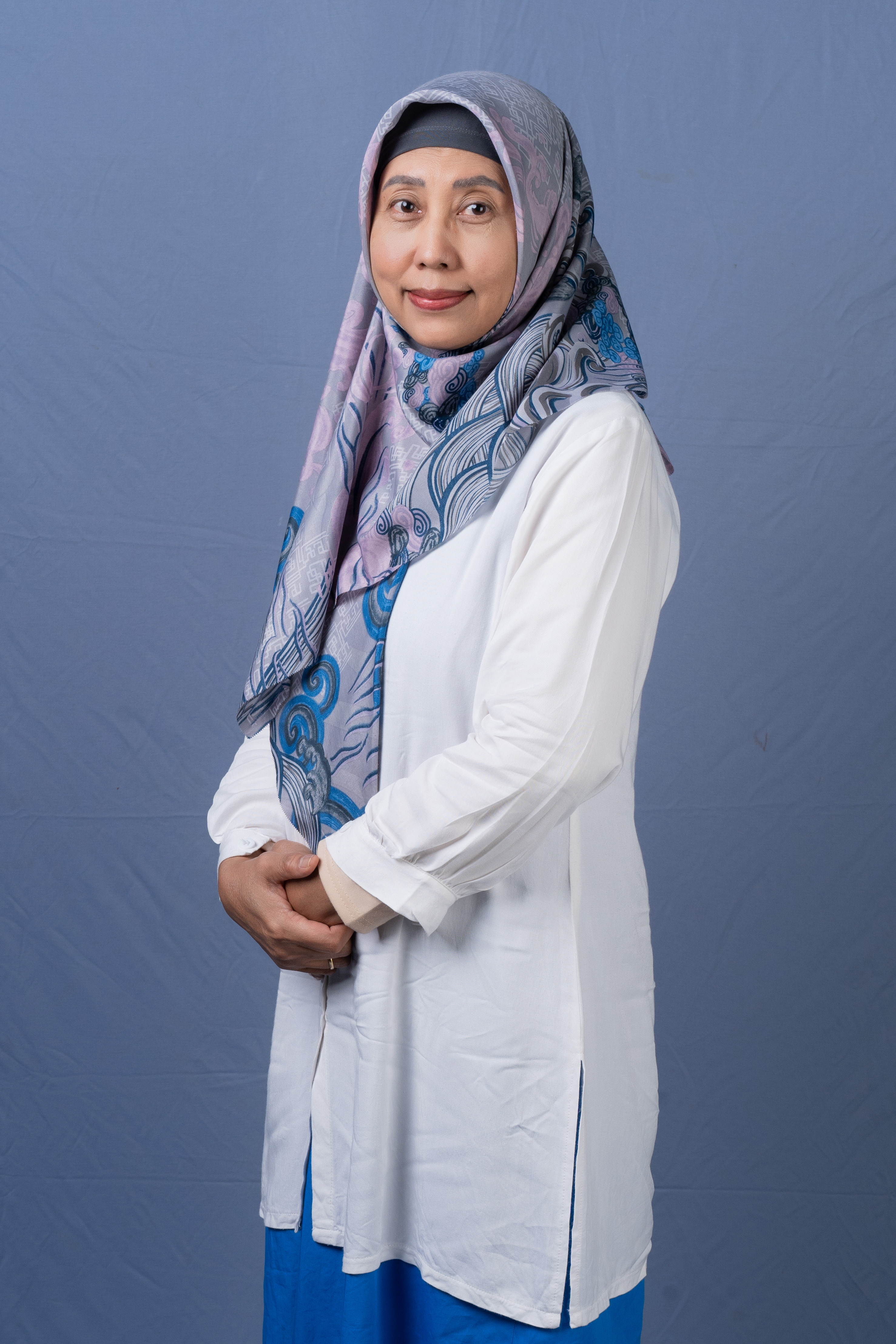 Dr.T, Dra. Nurul Hakimah, SST, M.Kes